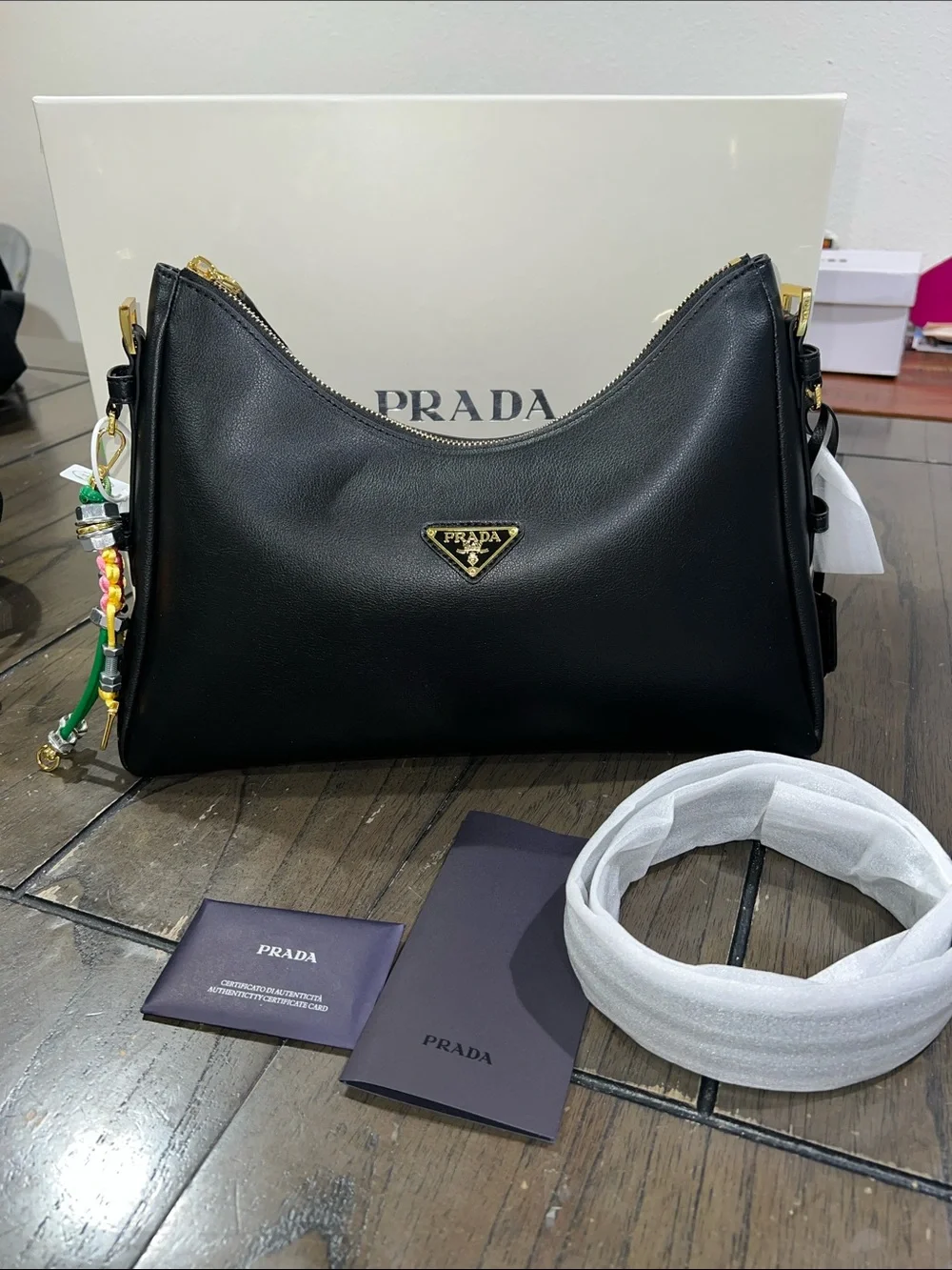 Black Leather Shoulder Bag with Gold Triangle Logo